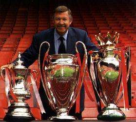 Ferguson con le coppe del Treble del 1999