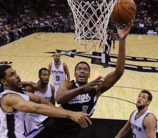 Spurs rally to beat Kings 106-99 